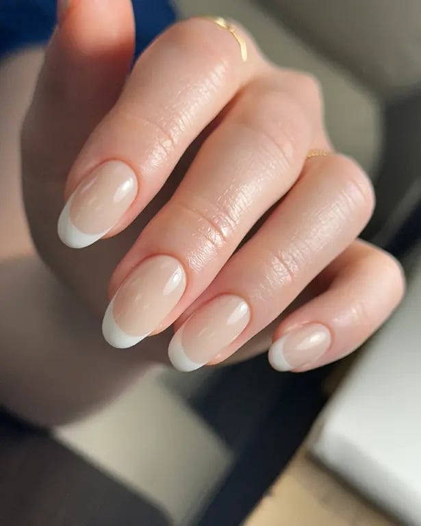 Nude Oval Nails With White French Tip Nude Oval Nails With White French Tip — Builder Gel Nails