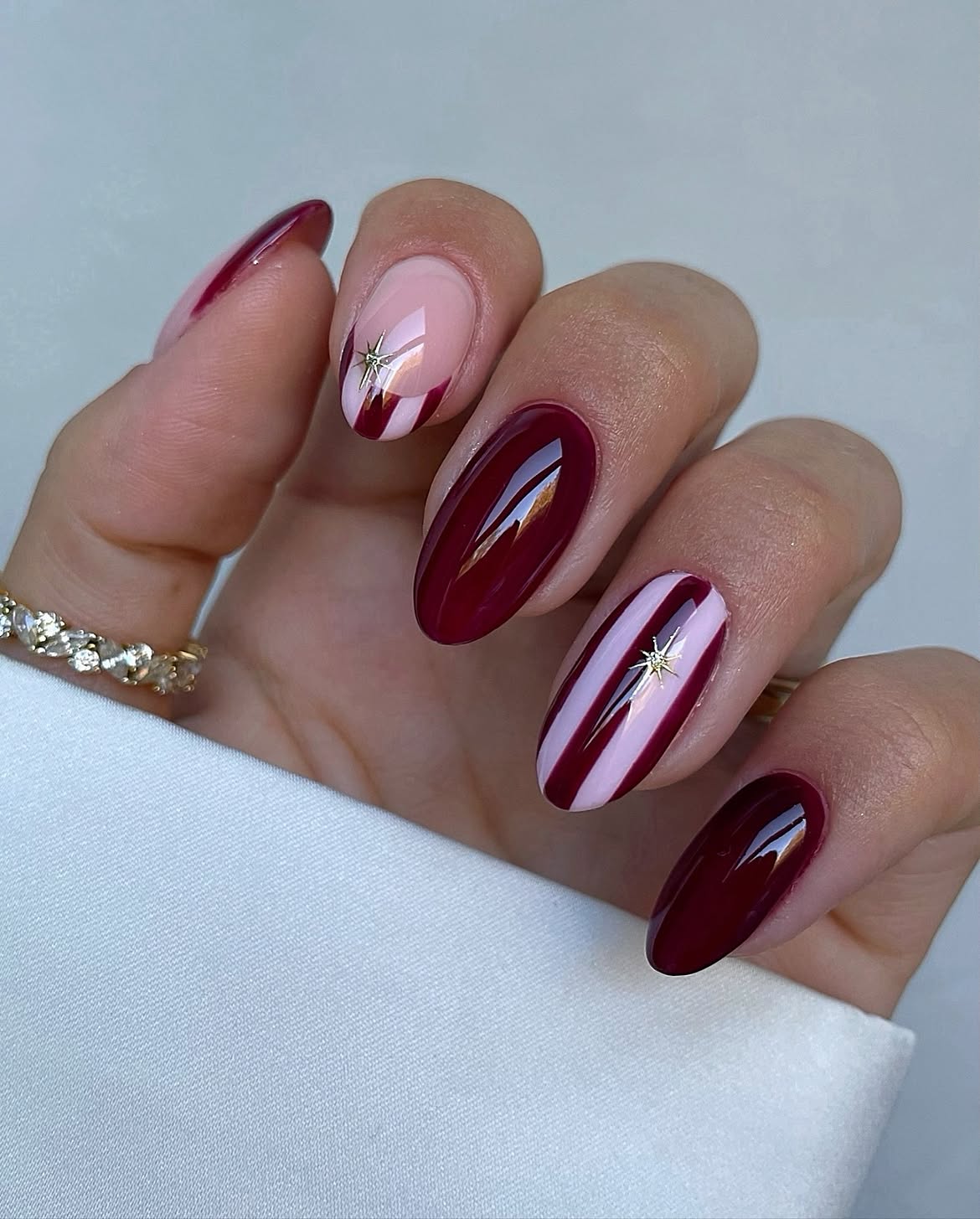 Burgundy Velvet Nails With Gold Celestial Stars