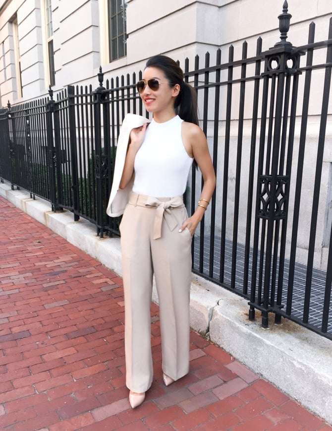 White blazer draped over mock neck top with paperbag trousers White blazer draped over mock neck top with paperbag trousers — Business Casual Outfits