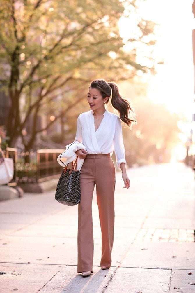 Cream blazer draped over white blouse and rose gold trousers Cream blazer draped over white blouse and rose gold trousers — Business Outfits