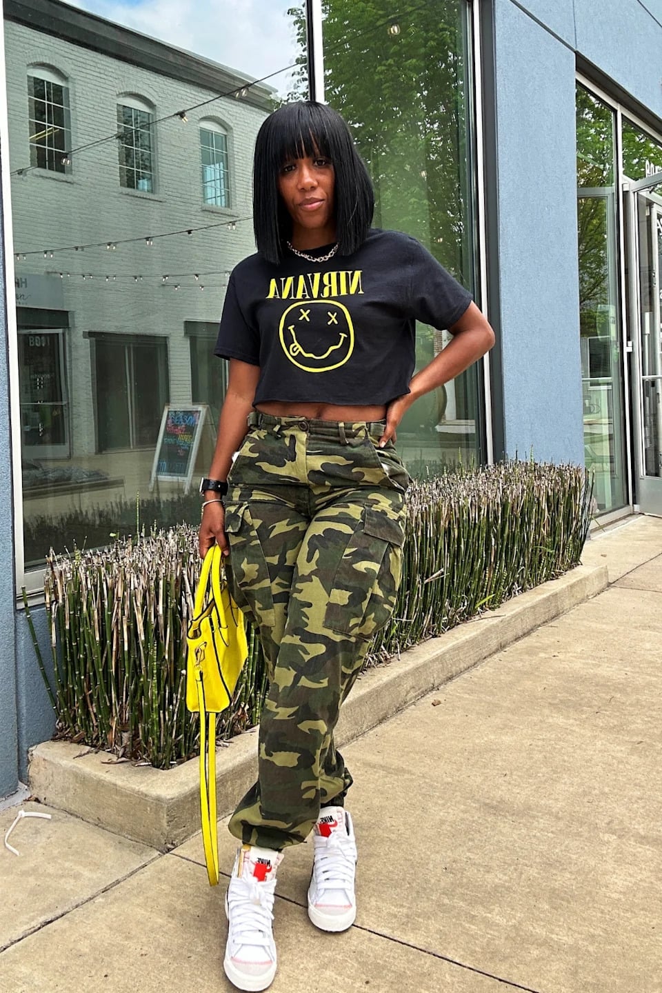 Yellow Bag and Red-Laced Sneakers Brighten Camo Pants Outfit Yellow Bag and Red-Laced Sneakers Brighten Camo Pants Outfit — Camo Outfits