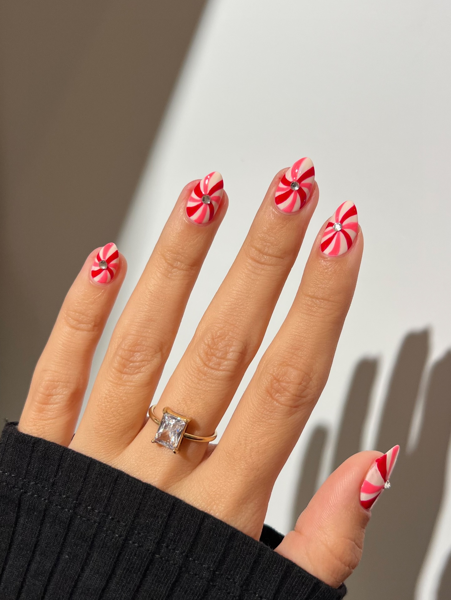 Candy Cane Swirl Almond Nails with Rhinestone Accent