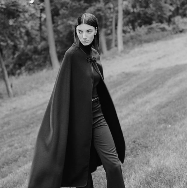 Structured black cape over turtleneck and gray trousers Structured black cape over turtleneck and gray trousers — Cape Outfits