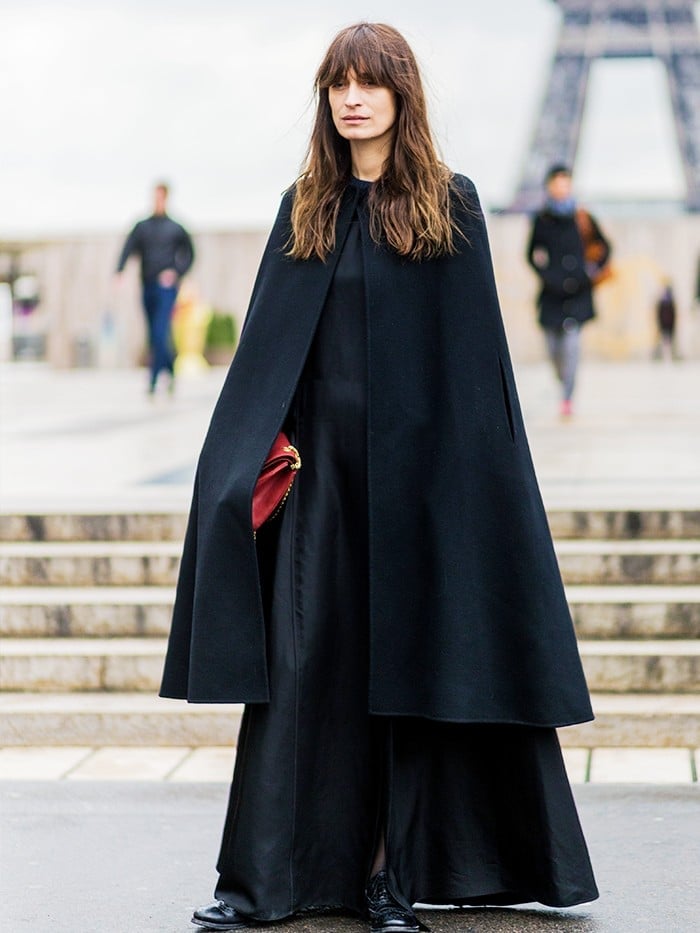 Elegant floor-length black cape over a matching dress Elegant floor-length black cape over a matching dress — Cape Outfits