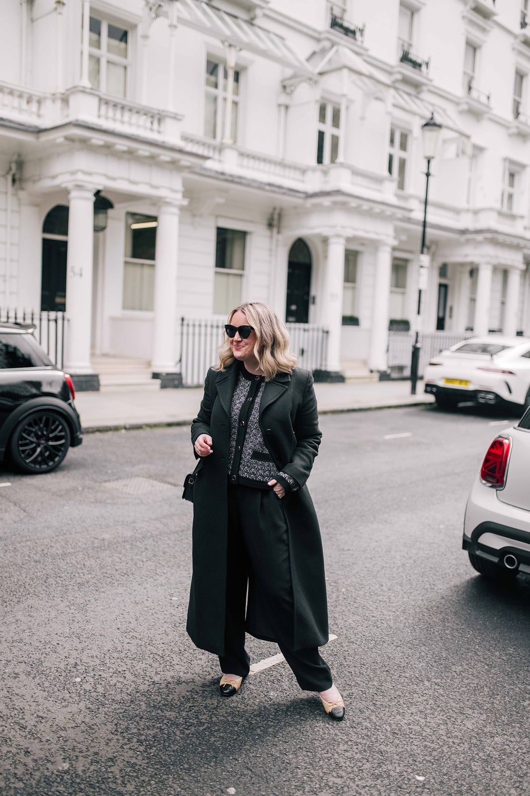 Dark Gray Coat Over Patterned Sweater and Black Trousers Dark Gray Coat Over Patterned Sweater and Black Trousers — Capsule Wardrobe