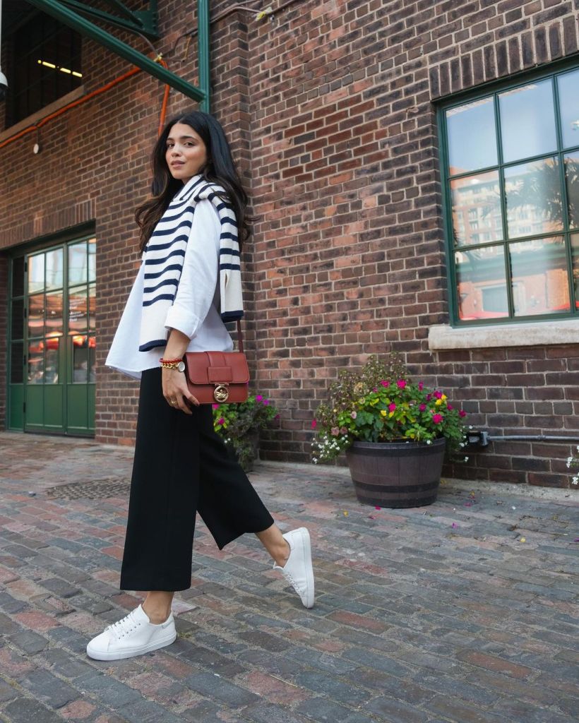 Cropped trousers with a sweater draped over shoulders Cropped trousers with a sweater draped over shoulders — Casual Church Outfit