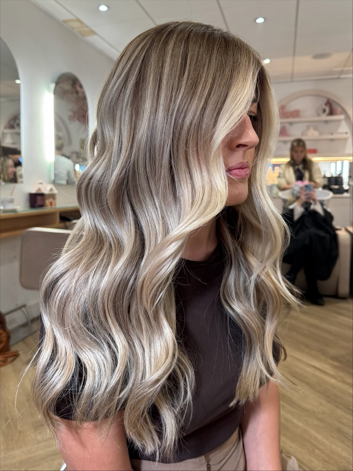 Champagne Blonde Waves With Face-Framing Layers