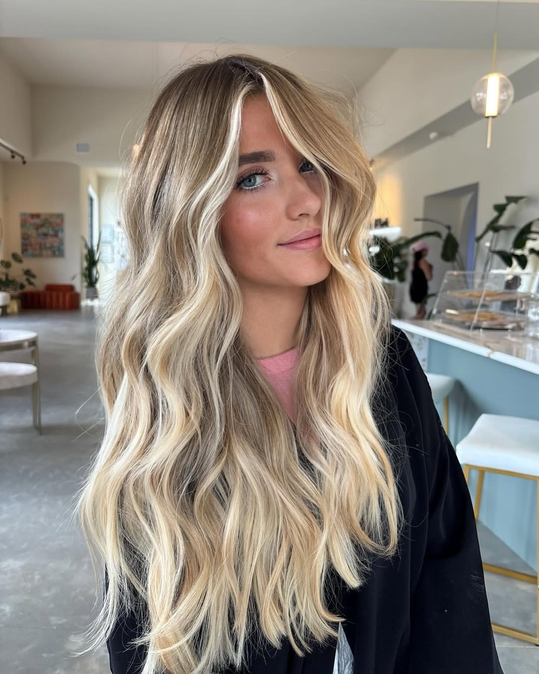 Champagne Blonde Waves With Face Framing Pieces