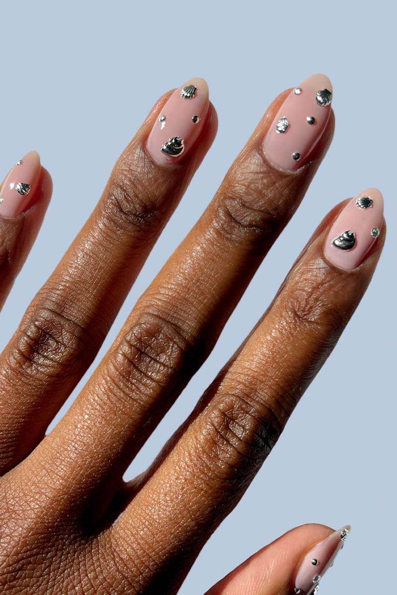 Medium Almond Nude Nails With Seashell Charms Medium Almond Nude Nails With Seashell Charms — Charm Nails