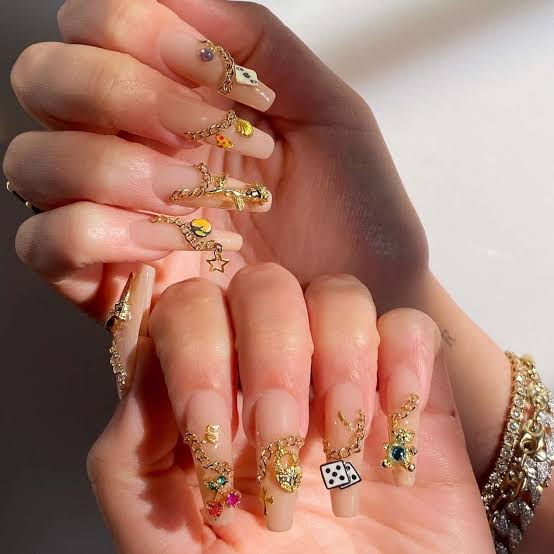 Short Oval Nude Nails With Geometric Charms Short Oval Nude Nails With Geometric Charms — Charm Nails