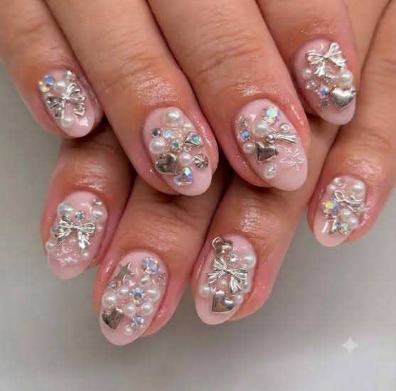 Short Medium Oval Pale Pink With Abundant Charms Short Medium Oval Pale Pink With Abundant Charms — Charm Nails