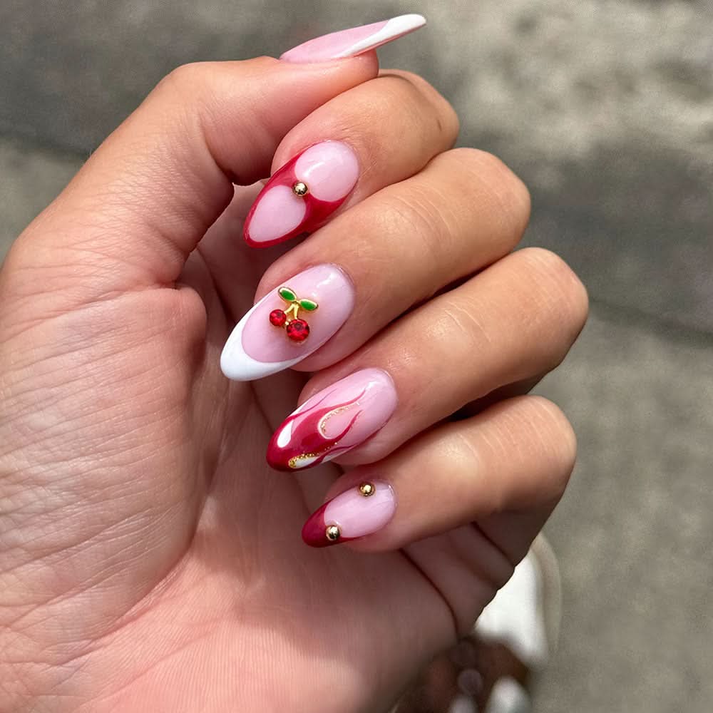 Long Stiletto Nude Nails With Maximalist Charms Long Stiletto Nude Nails With Maximalist Charms — Charm Nails