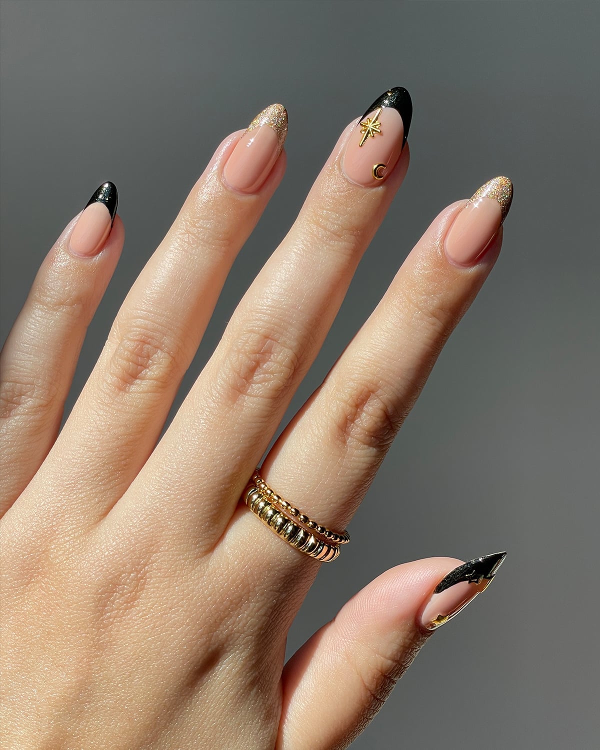 Medium Almond Nude Black French With Celestial Charms Medium Almond Nude Black French With Celestial Charms — Charm Nails