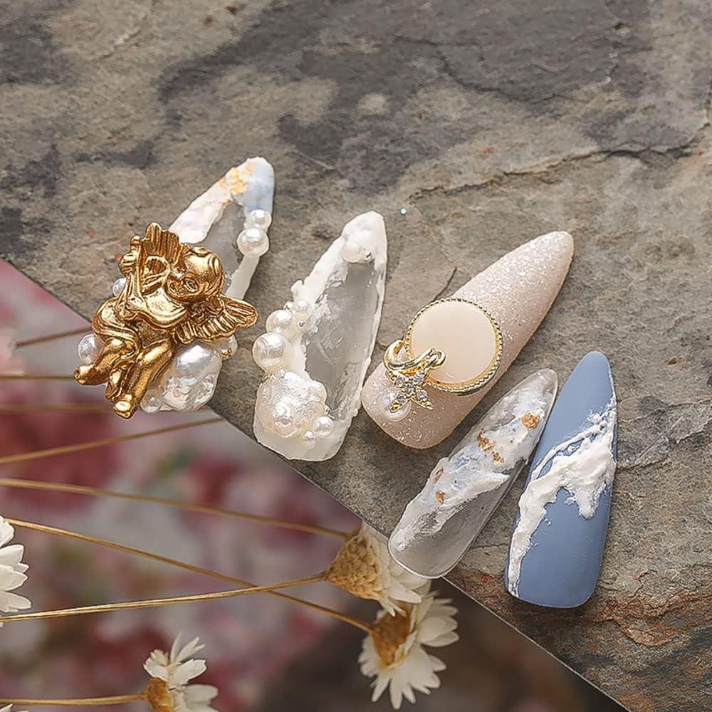 Almond Nails With Gold Angel Charm And Pearls Almond Nails With Gold Angel Charm And Pearls — Charm Nails