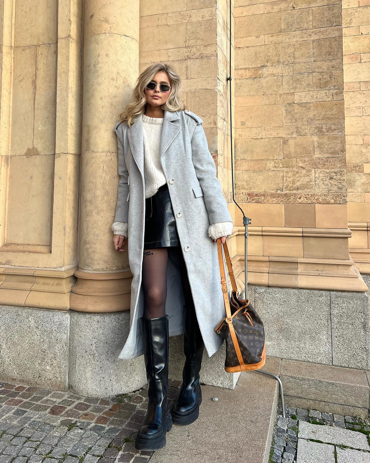 Chic Grey Coat Over Cream Sweater And Leather Skirt