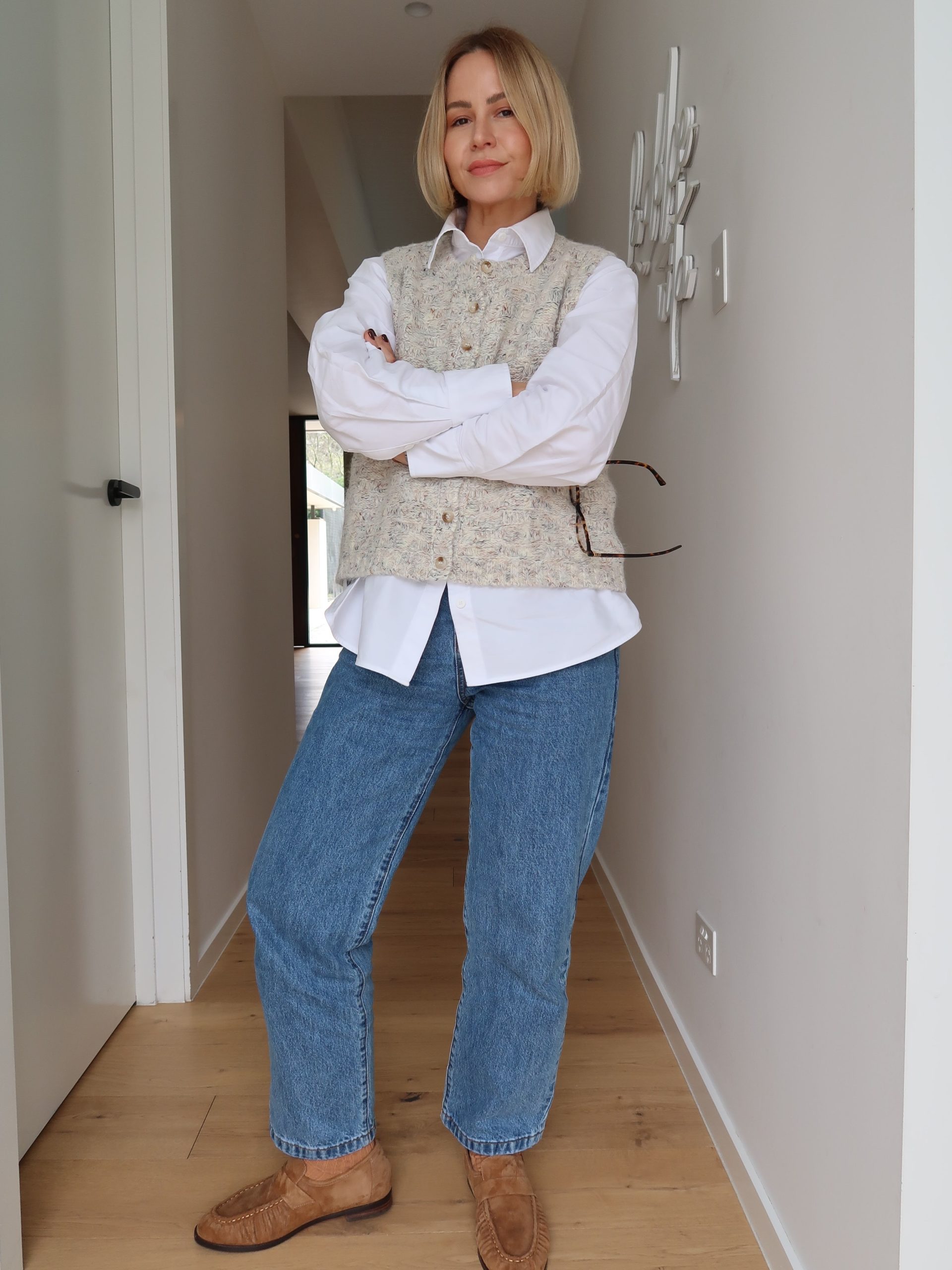 Chic Knit Vest Over Crisp White Shirt and Jeans