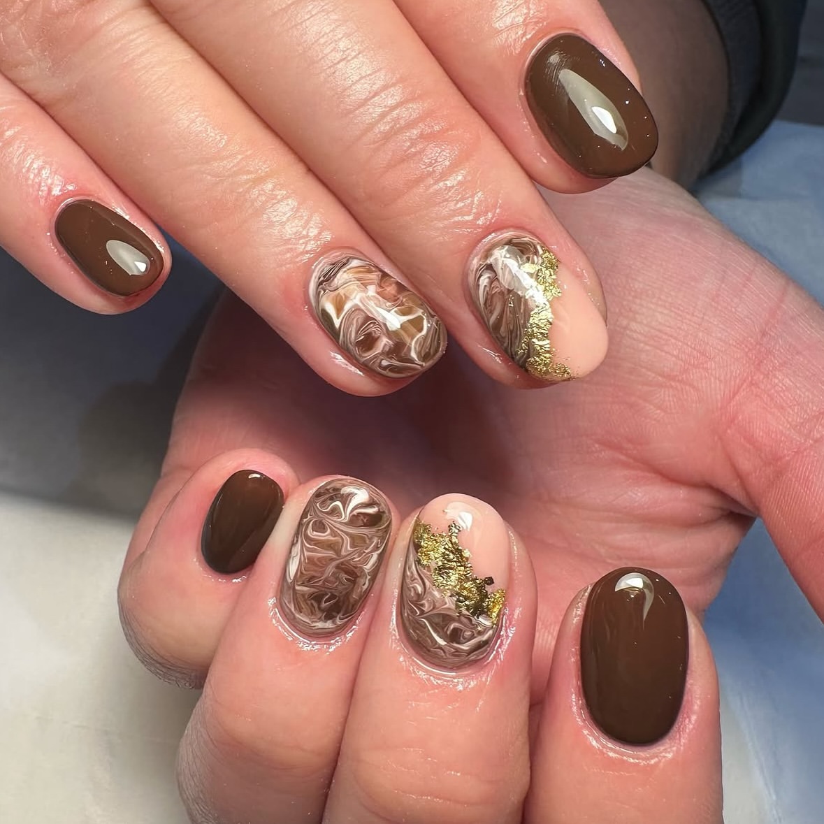 Chocolate Swirl Milk And Gold Foil Nails
