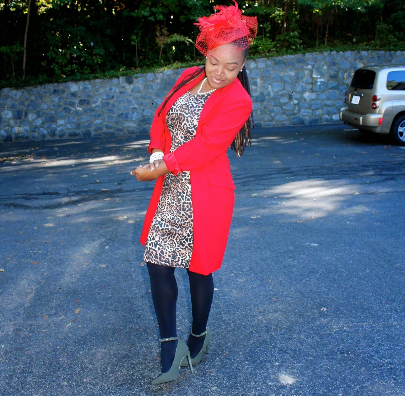 Leopard print dress under red coat with fascinator Leopard print dress under red coat with fascinator — Church Outfits Black Women