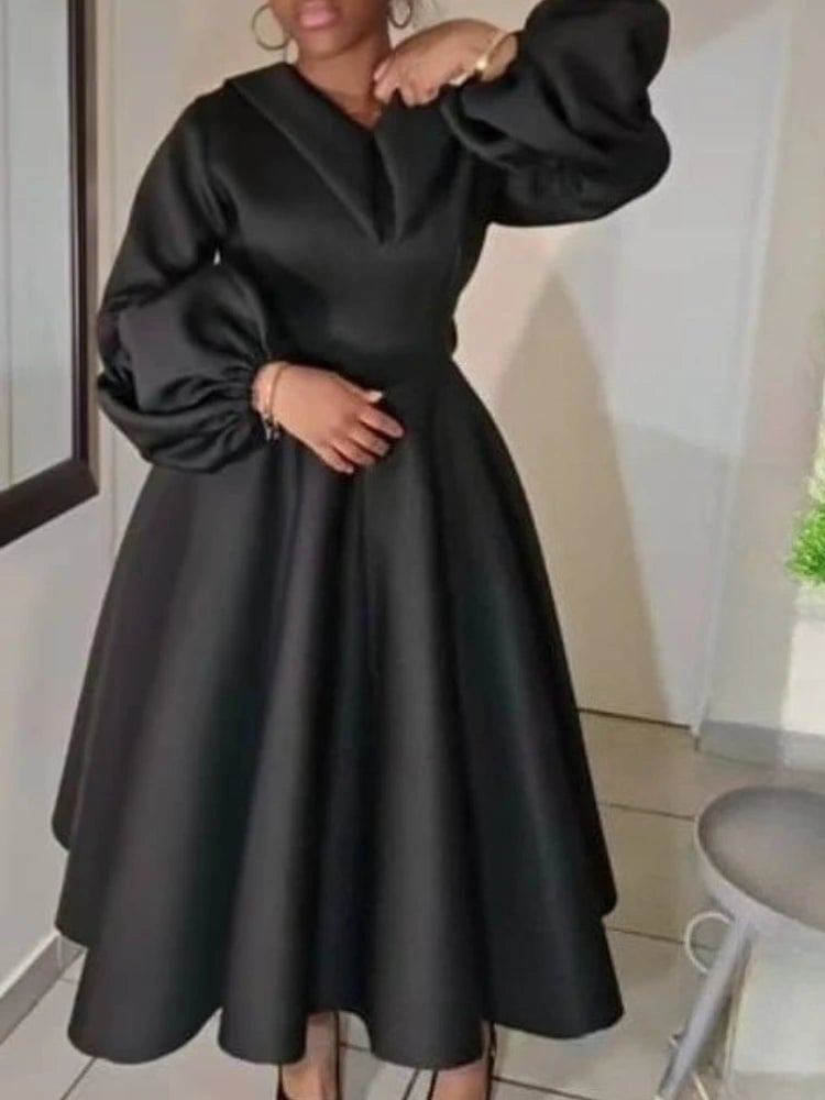 Black midi dress with dramatic puff sleeves and full skirt Black midi dress with dramatic puff sleeves and full skirt — Church Outfits Black Women