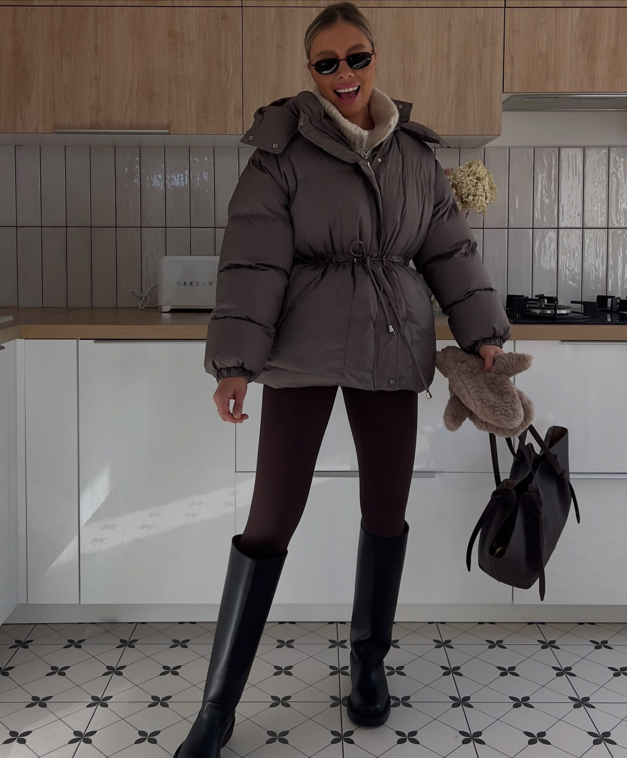 Cinched Waist Puffer With Tall Boots and Tights