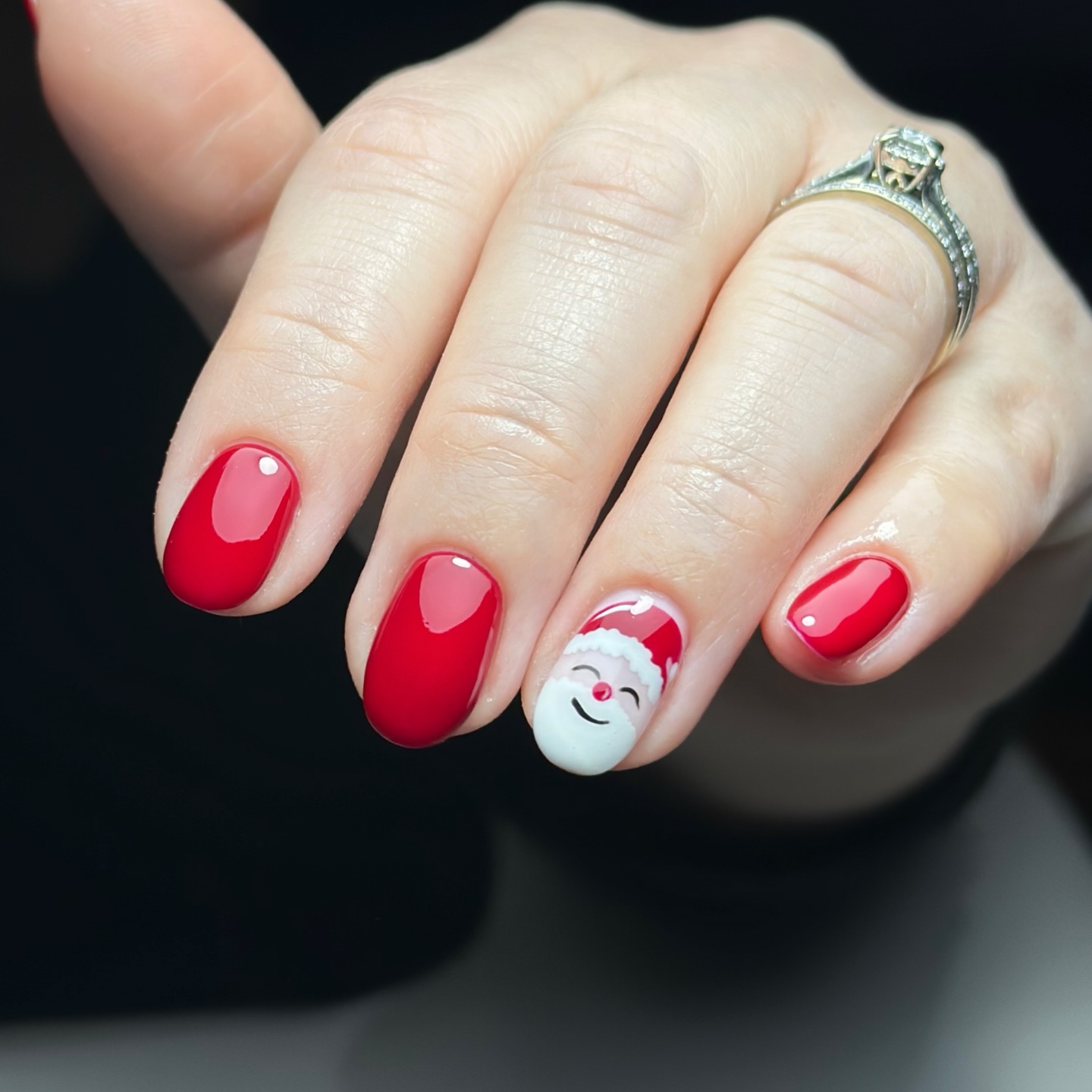 Classic Red Glossy Oval Nails With Santa Art