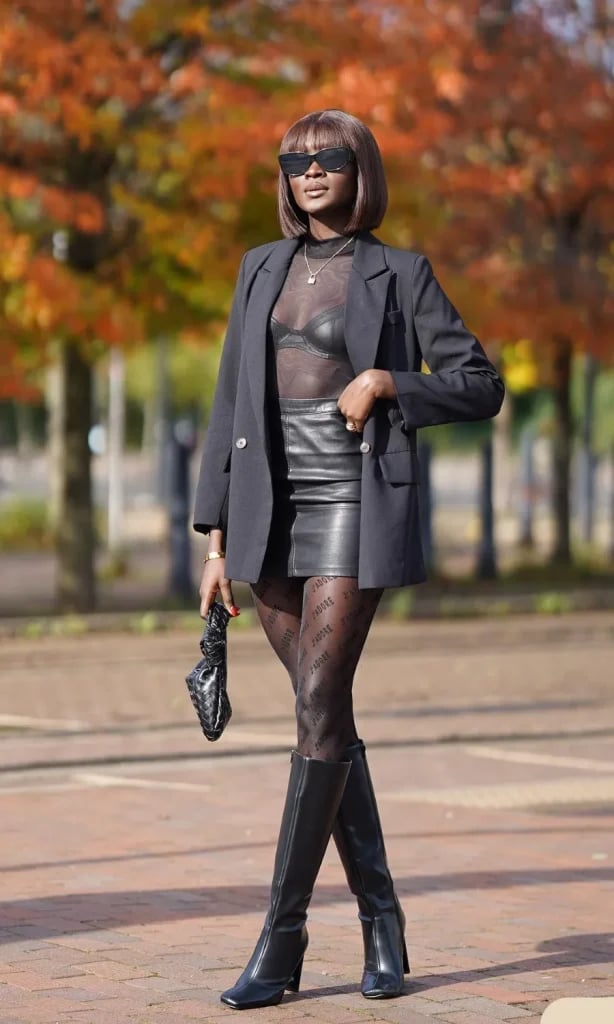 Black Blazer over Sheer Bra Top and Logo Tights with Knee-High Boots Black Blazer over Sheer Bra Top and Logo Tights with Knee-High Boots — Club Outfits Black Women