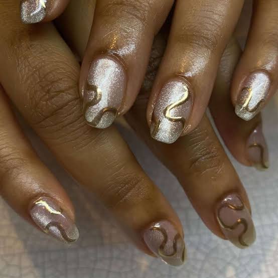 White Oval Nails With Gold Swirls White Oval Nails With Gold Swirls — Concert Nails