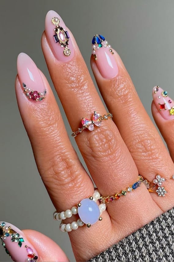 Sheer Pink French Tips With Ornate Gem Accents Sheer Pink French Tips With Ornate Gem Accents — Concert Nails