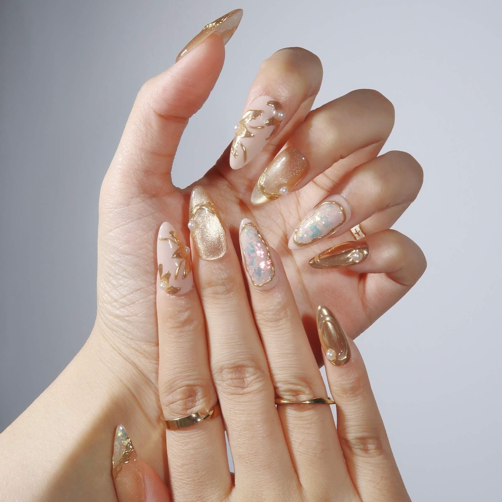 Sheer Nude Gold Leaf Pearl Almond Nails Sheer Nude Gold Leaf Pearl Almond Nails — Concert Nails