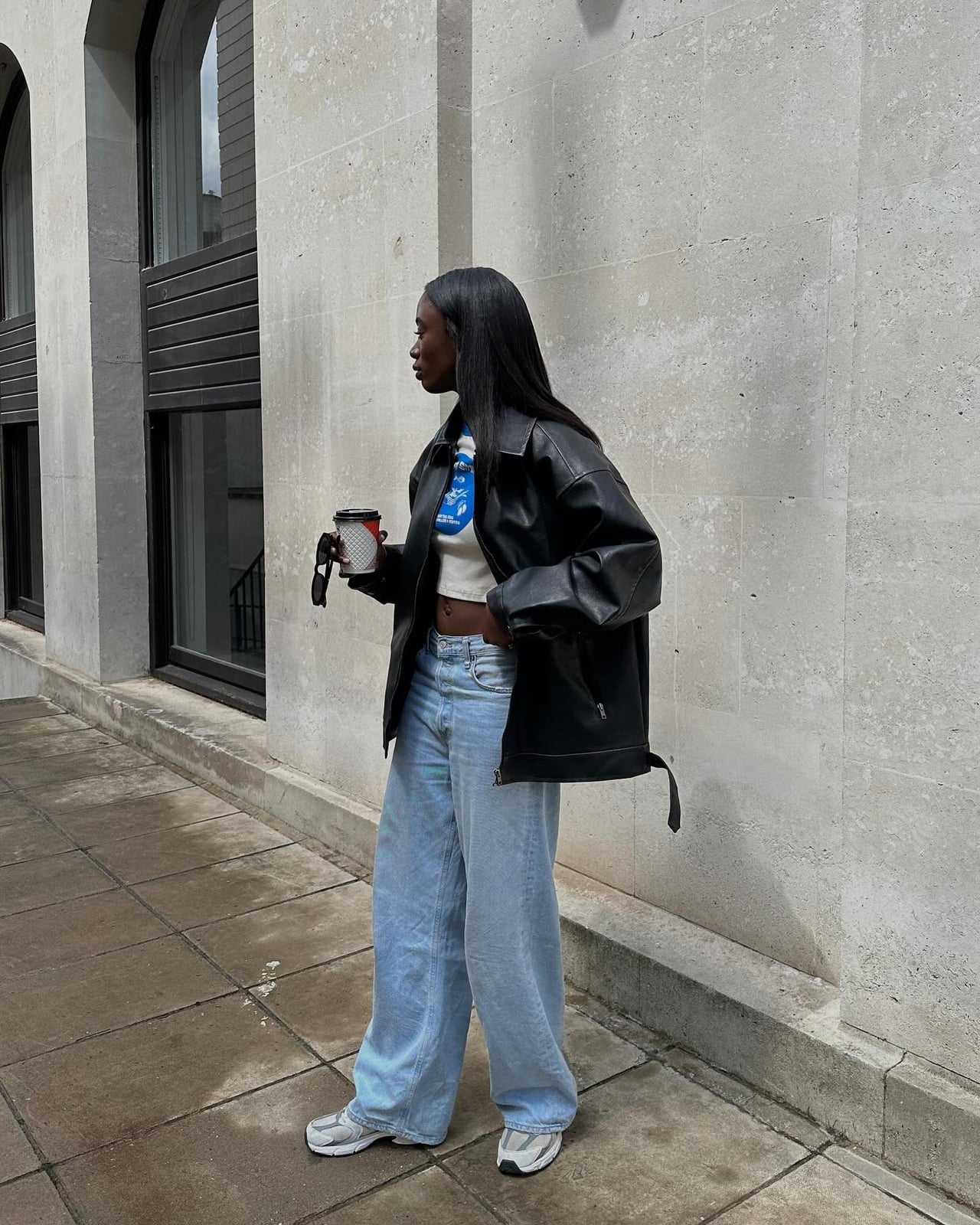 Oversized Leather Jacket With Graphic T-Shirt And Wide-Leg Jeans Oversized Leather Jacket With Graphic T-Shirt And Wide-Leg Jeans — Concert Outfits Black Women