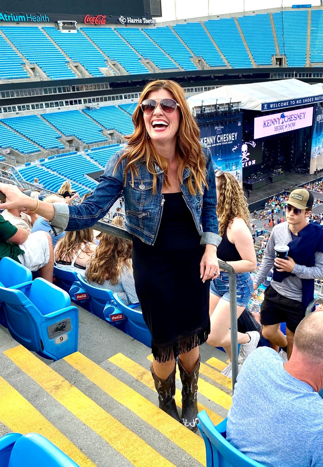 Strapless dress with fringe and denim jacket with cowboy boots Strapless dress with fringe and denim jacket with cowboy boots — Country Concert Outfits Ideas