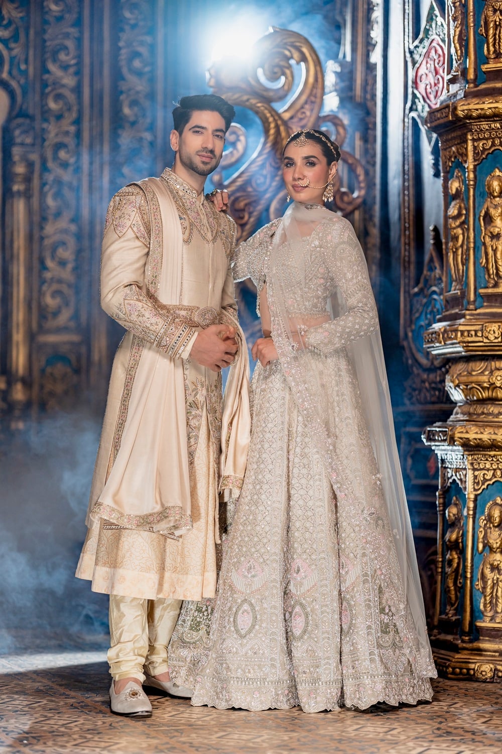 Ornate Cream and Gold Wedding Couple Attire, Close-Up Take Ornate Cream and Gold Wedding Couple Attire, Close-Up Take — Couple Outfit