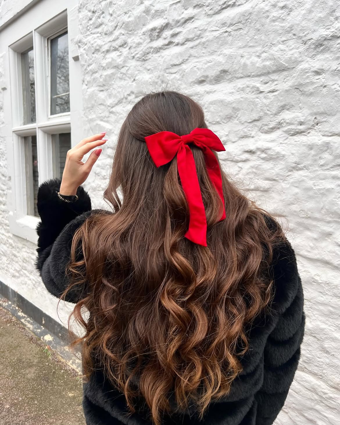 Cozy Curls With Festive Red Bow