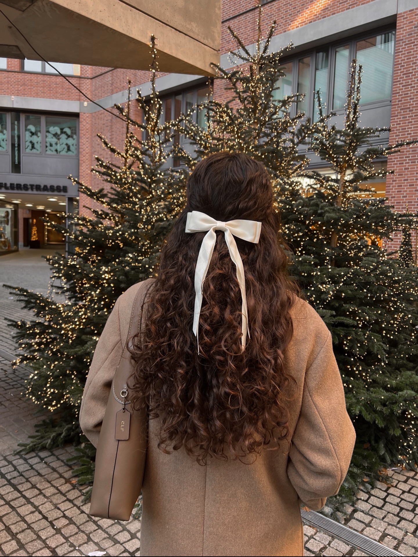 Cozy Curly Half-Up With Cream Bow