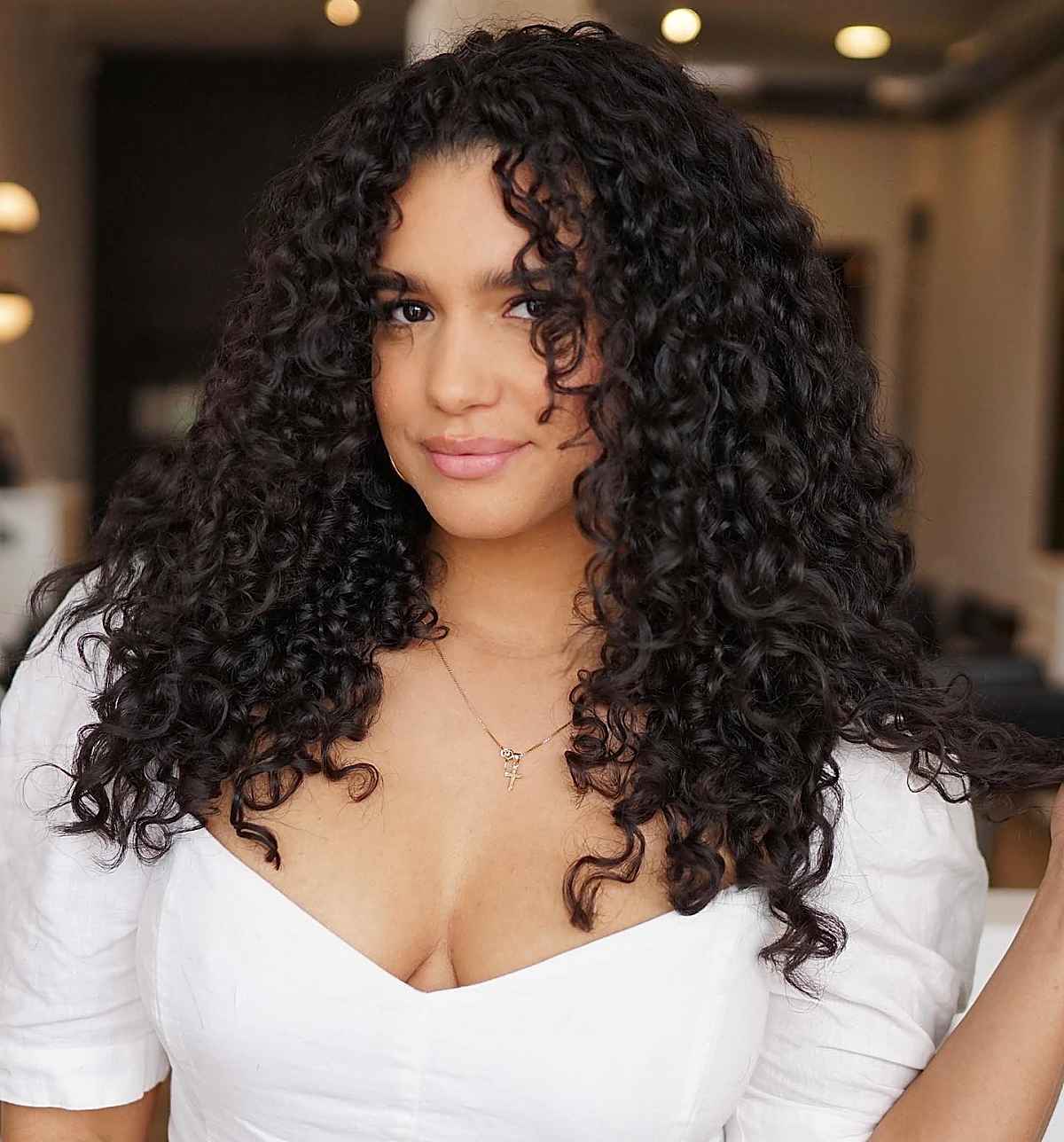 Mid-Back Curly Hair With Caramel Highlights Mid-Back Curly Hair With Caramel Highlights