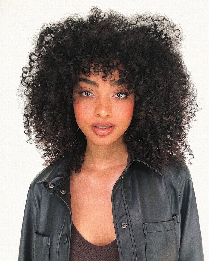 Voluminous Mid-Back Curly Hair With Full Bangs Voluminous Mid-Back Curly Hair With Full Bangs — Curly Hair with Bangs