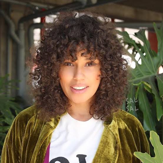 Shoulder-Length Layered Shag With Thick Curly Bangs Shoulder-Length Layered Shag With Thick Curly Bangs — Curly Hair with Bangs