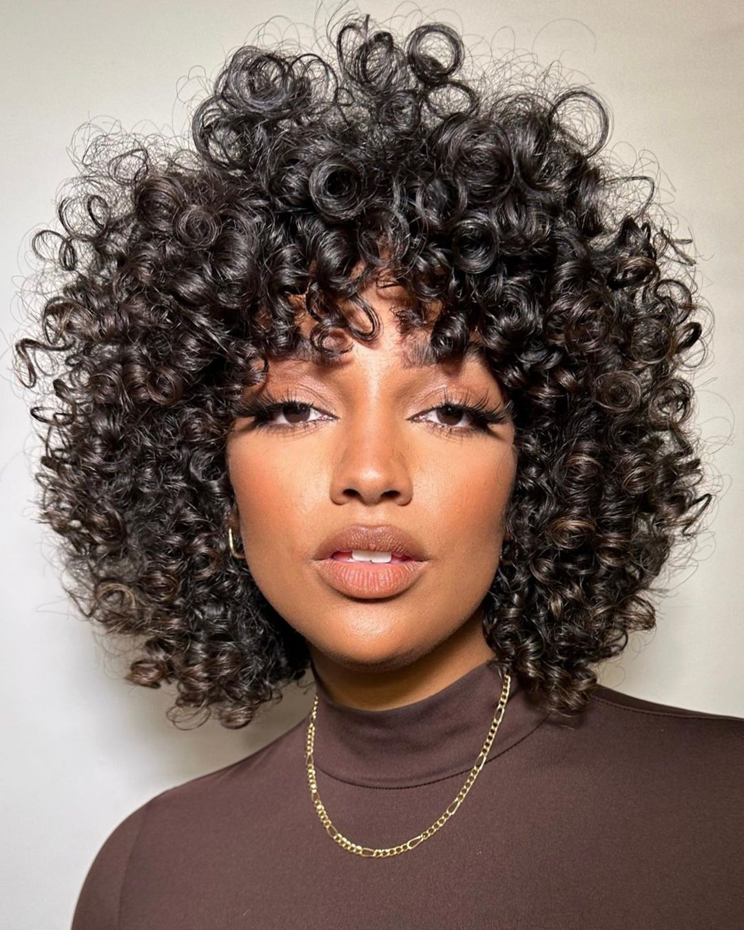 Shoulder-Length Curly Hair With Full Bangs Shoulder-Length Curly Hair With Full Bangs — Curly Hair with Bangs