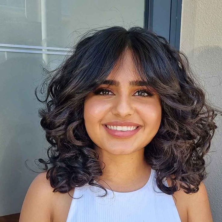 Collarbone Layers With Soft Curtain Bangs and Subtle Highlights Collarbone Layers With Soft Curtain Bangs and Subtle Highlights — Curly Hair with Bangs