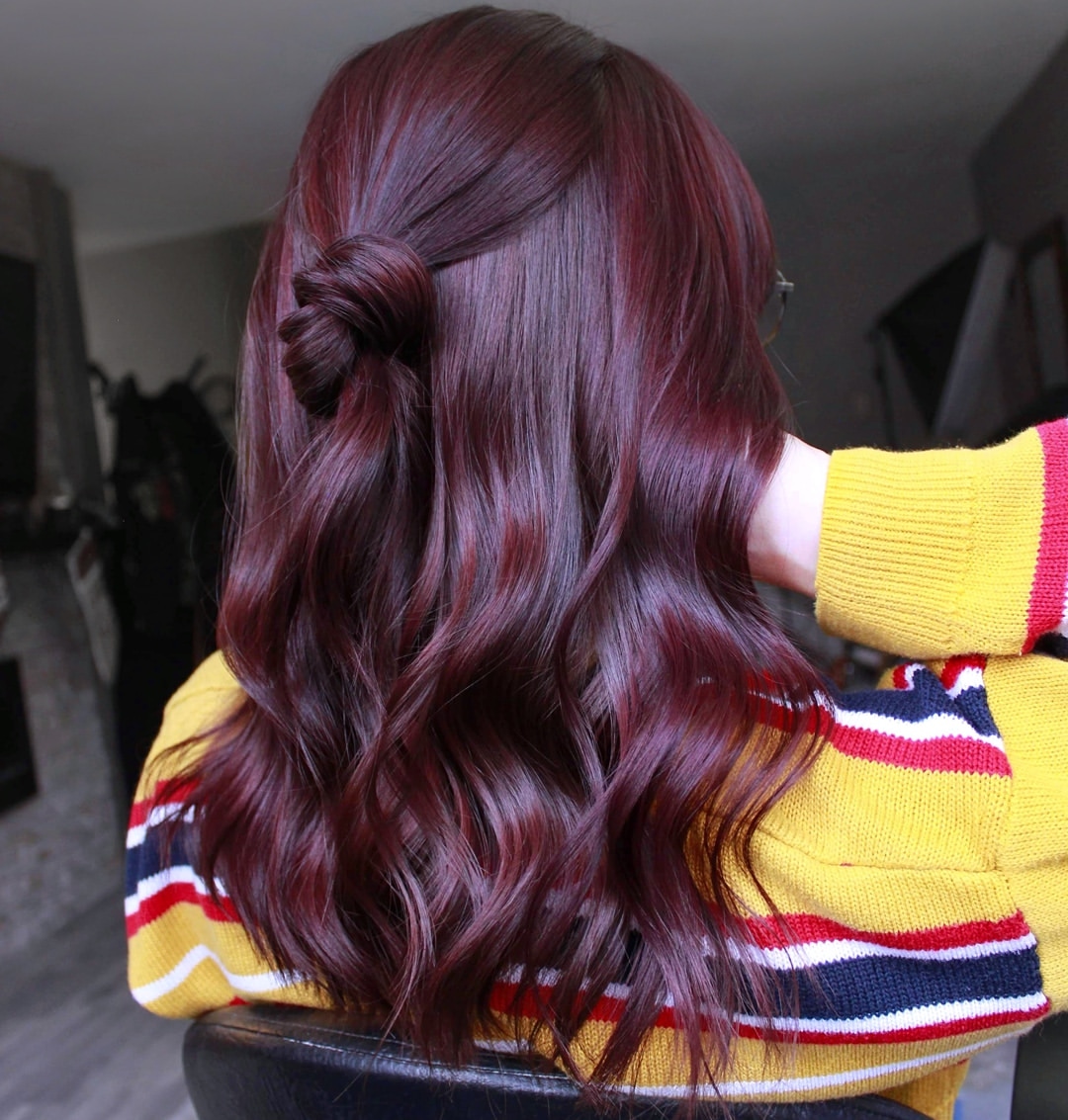 Deep Burgundy Half Up Top Knot On Long Wavy Hair