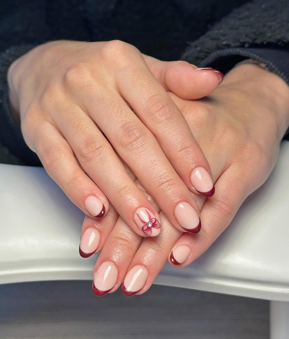 Deep Red French Tip Bow Accent Nails