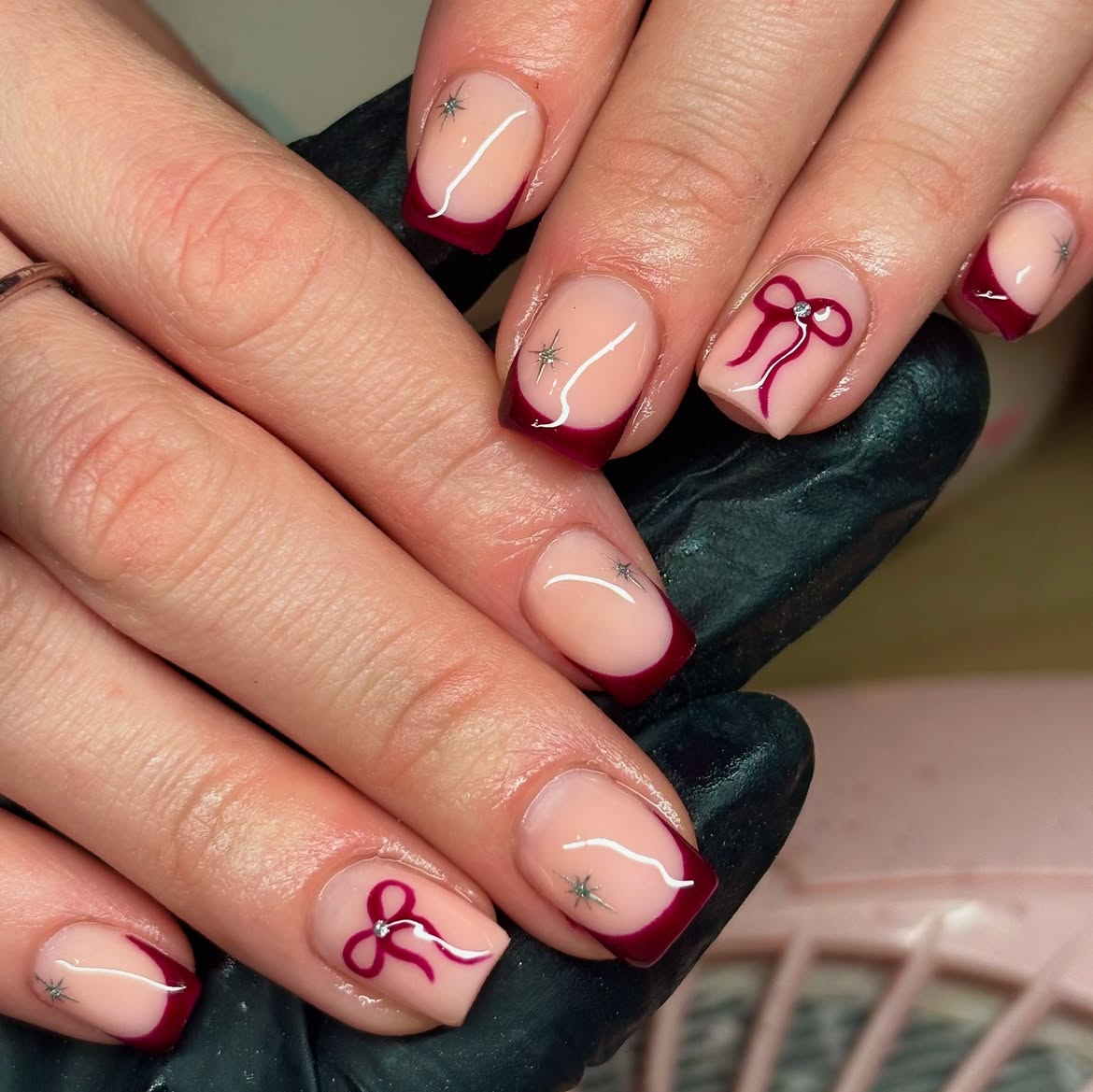 Deep Red French Tip Nails with Bow Art