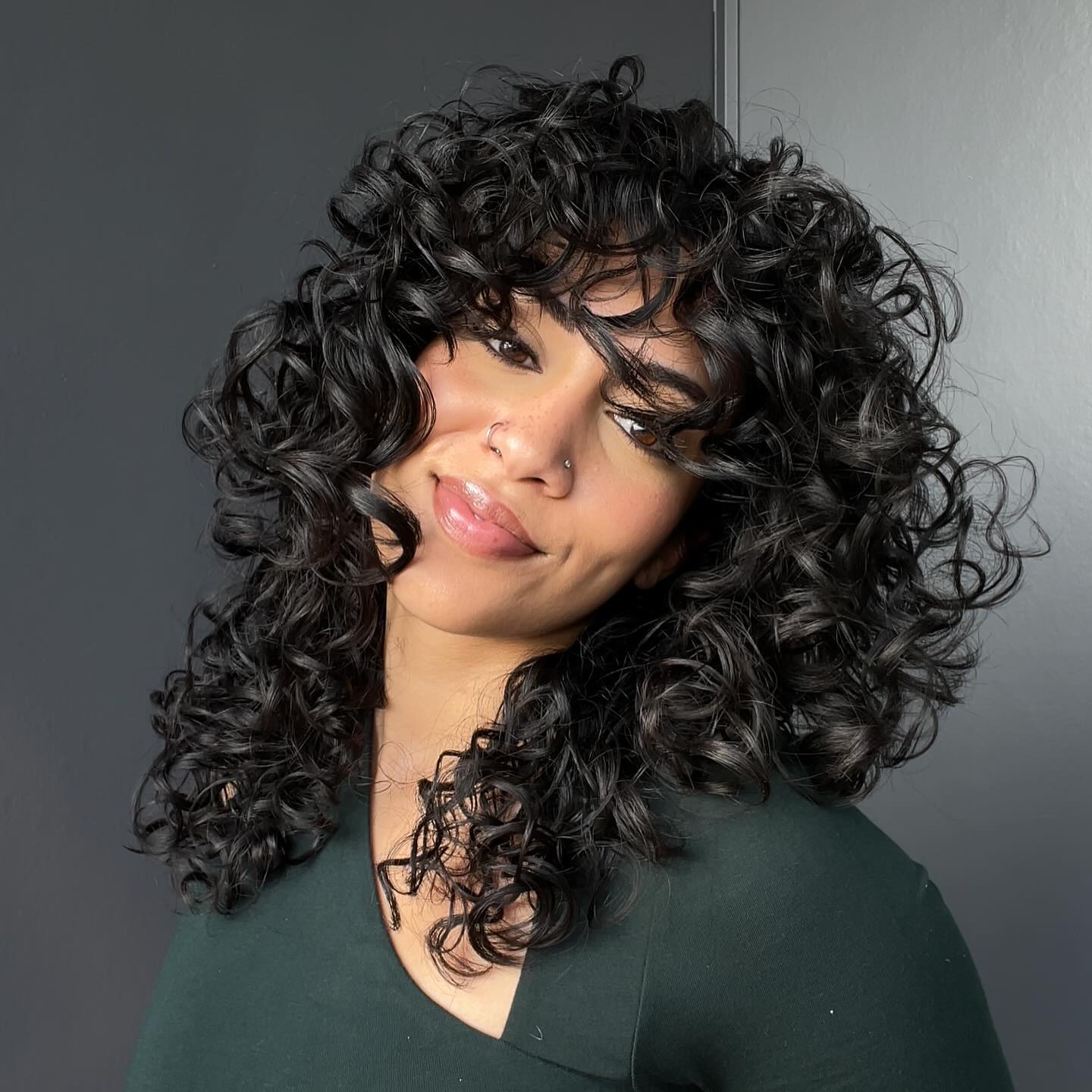 Defined Ringlets With Face Framing Curly Bangs
