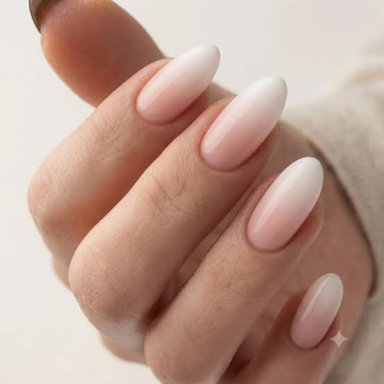 Medium Almond Milky Pink to Sheer White Ombre Dip Nails, Close-Up Take Medium Almond Milky Pink to Sheer White Ombre Dip Nails, Close-Up Take