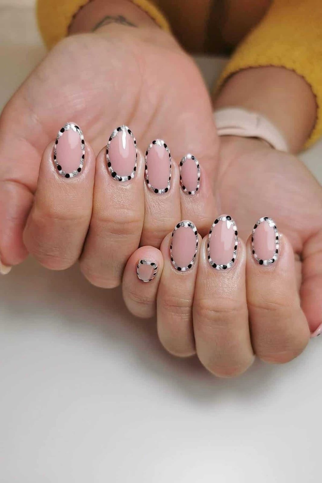 Light Pink Nails with Black and Silver Dot Border Light Pink Nails with Black and Silver Dot Border — Dots Nail Designs