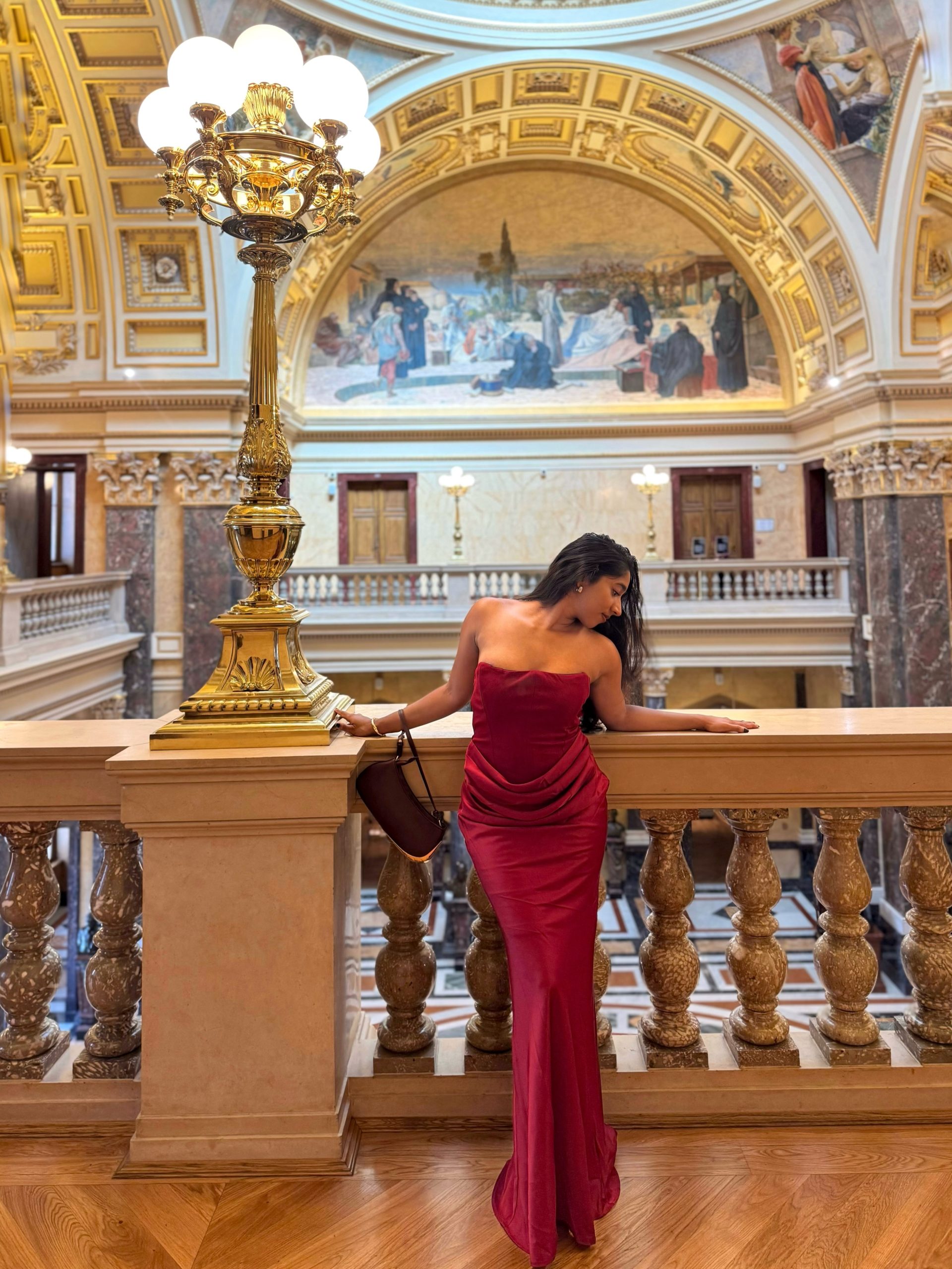 Dramatic Red Strapless Gown With Elegant Draping