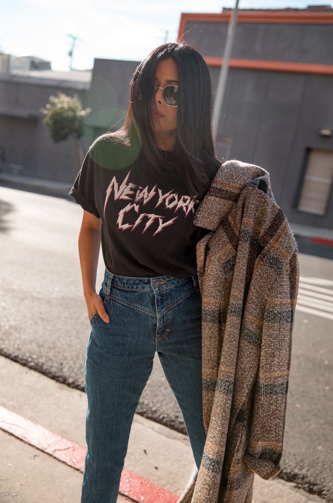 Plaid jacket draped over graphic t-shirt and jeans Plaid jacket draped over graphic t-shirt and jeans — Edgy Outfits