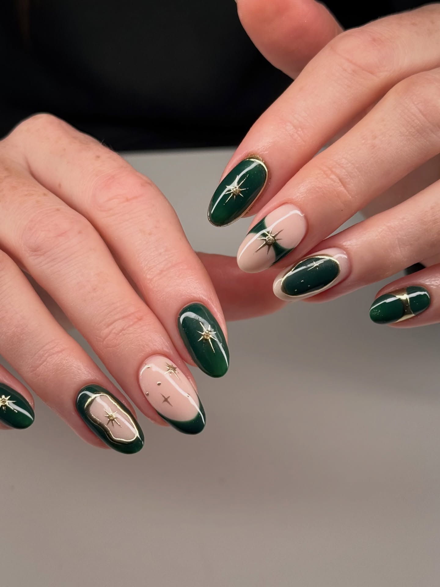 Emerald Green Oval Nails with Gold Star Accents