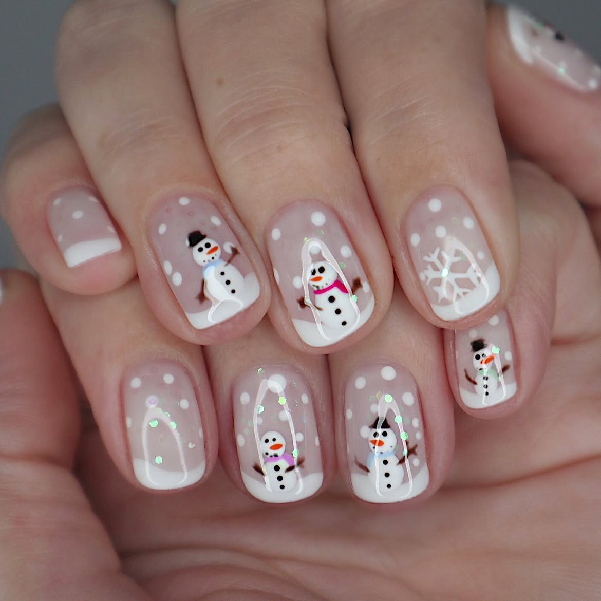 Enchanting Snow Globe Nails With Cute Snowmen