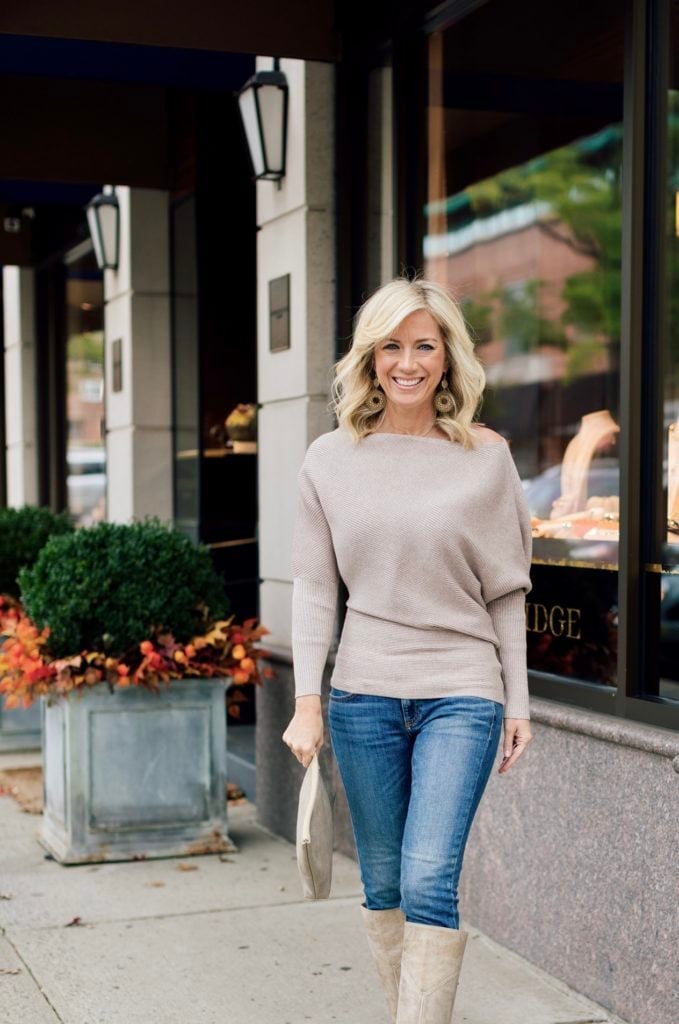 A beige off-the-shoulder sweater with slim-fit blue jeans A beige off-the-shoulder sweater with slim-fit blue jeans — Feminine Style